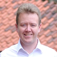 Headshot photo of Dr Paul McNaughter